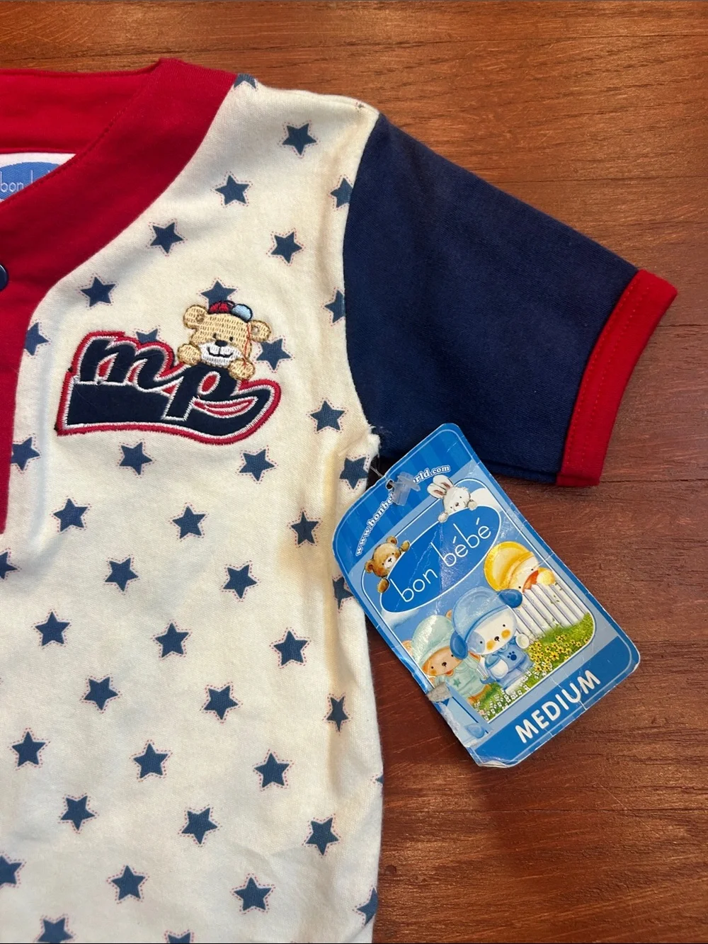 Bon Bebe Cream One-Piece with Navy Stars and Red Trim